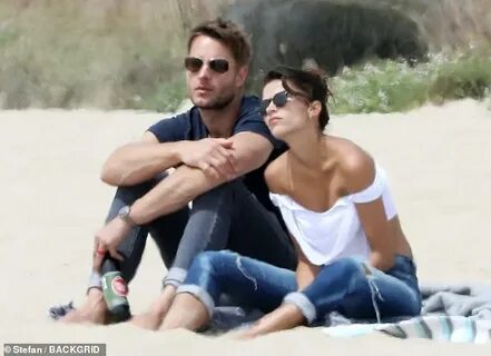 Justin Hartley is seen wearing a ring on THAT finger while s