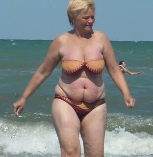 Two fat grannys are gangbanged on the beach
