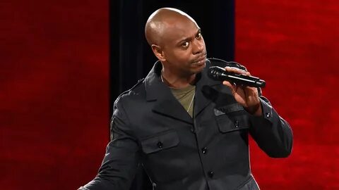 Image may contain Dave Chappelle Human Person Crowd Audience Clothing Appar...