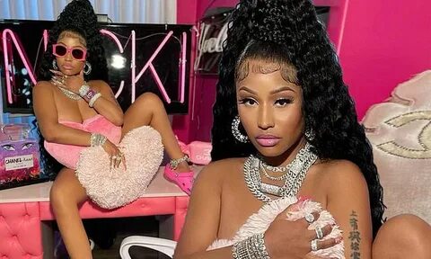 Nicki Minaj seemingly poses nude in hot pink office space fo