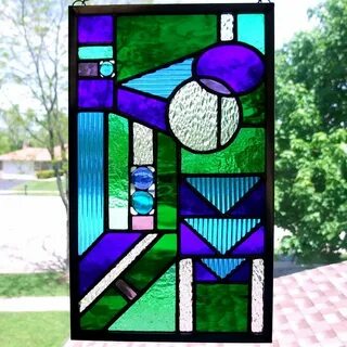 Blues and greens geometric stained glass panel Stained glass