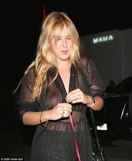 Braless Scout Willis exposes her bare bust in sheer jumpsuit