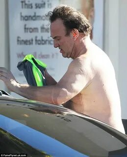 Jim Belushi, 60, whips off his shirt after working up a swea