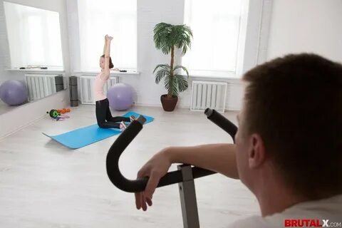 Trainer makes cutie work out by fingering her tight asshole