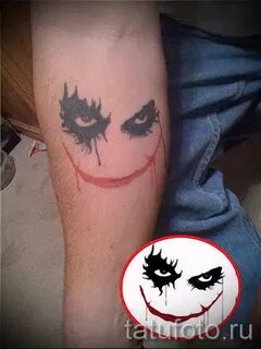 photo example of a joker tattoo - smiley on hand - tatufoto.