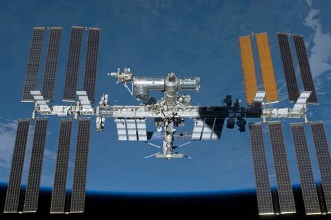 The International Space Station, photographed by an STS-134 