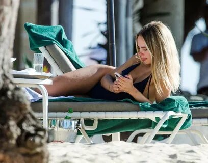 Kimberley Garner - In a one piece bikini on the beach in Bar