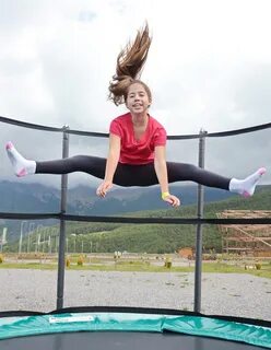 Teenage girl jumping on a trampoline Golem.sk