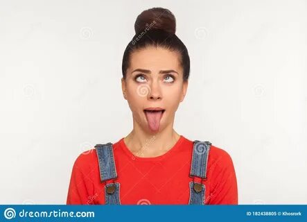 Closeup of Amusing Funny Girl with Hair Bun Looking Up with 