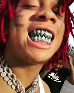 Trippie Redd's blue diamond fangs grill is reportedly w