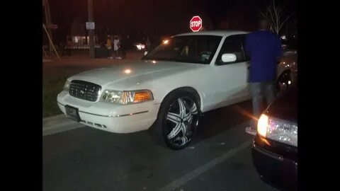 White on White Crown Vic on Diablo 26s and Grand Marquis on 