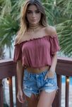 off the shoulders pink top cropped with jean shorts and cute