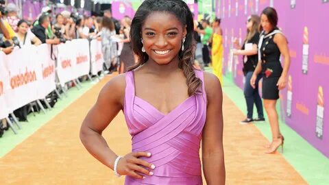 Olympian Simone Biles on why she loves her muscular arms