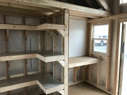 Shelving, pegboards, a workbench, and a loft. This storage s