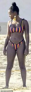 Janelle Monae showcases her flawless figure in a skimpy stri