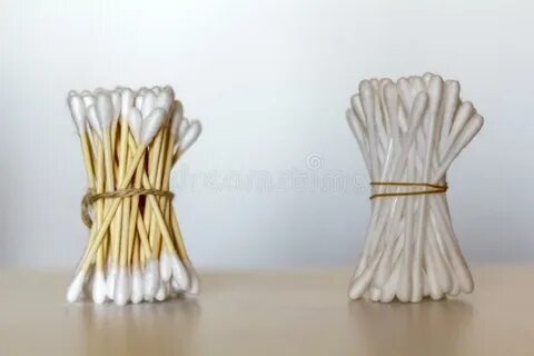 Bamboo Cotton Swabs and Plastic Cotton Swabs Over Wooden Tab