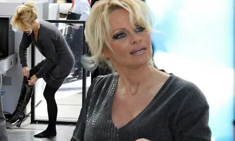 Pamela Anderson struts through airport in a pair of thigh-hi