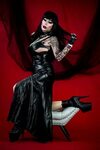Gothic diva in leather dress and boots Makeup by Amanda Ri. 
