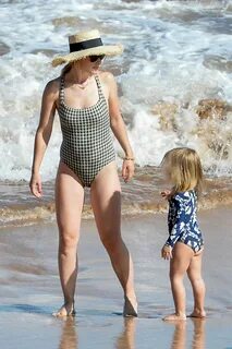 olivia wilde dons a checkered swimsuit while enjoying a beac