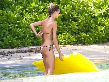 Sharni Vinson goes topless on Hawaiian beach showing off her