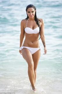 Tulisa shows off toned figure as she makes TV return in whit
