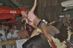 Riding a mechanical bull in a short tops and accidentally sh