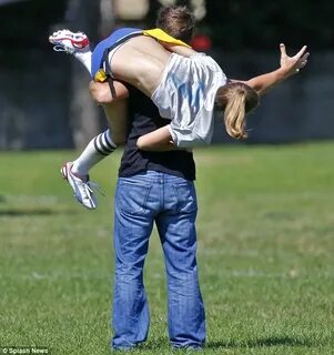 Leggy AnnaLynne McCord shows off her toned tummy for footbal