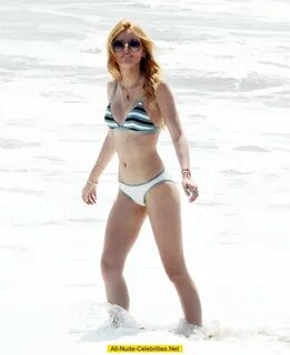 Bella Thorne in bikini on a beach