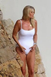 Christie Brinkley in White Swimsuit at Hotel Eden Roc in Ant