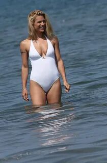 MICHELLE HUNZIKER in Swimsuit and Bikini at a Beach at Forte