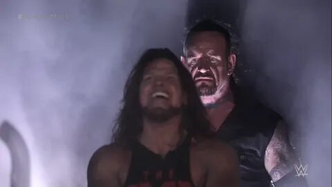 teleports behind you* Undertaker Standing Behind AJ Styles K