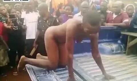 Woman stripped naked captive paraded