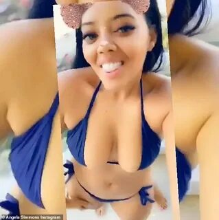 Angela Simmons flaunts her cleavage and curves in bikini and