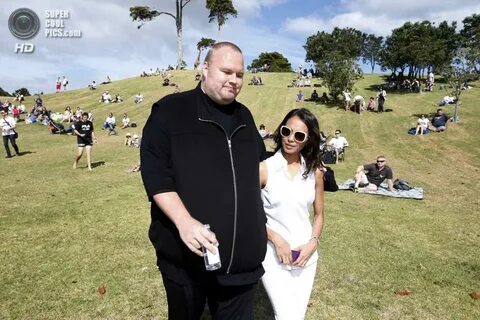 Kim Dotcom and his wife Mona walk during his Internet Party 