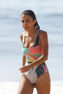 BETHENNY FRANKEL in Swimsuit Surfing at a beach in The Hampt