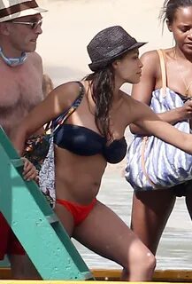 Rosario Dawson - Bikini Candids on a beach in the Barbados. 