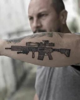 Pin on 25 of the Best Gun Tattoos