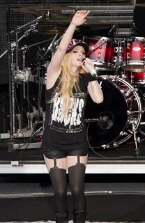 Avril Lavigne in shorts and pantyhose performing in Mountain