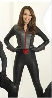 Kelli Berglund as Bree Davenport in black/grey mission-suit 