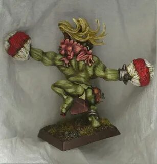 CoolMiniOrNot - Orc Cheerleader from behind (and her Squig) 