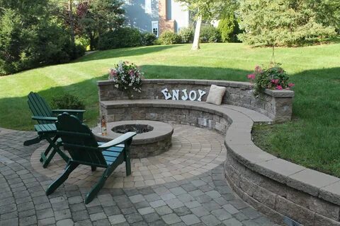 Paver patio with a Techo-Bloc Fire Pit and built in Sitting 