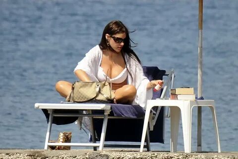 Sofia Vergara in skimpy bikini sunning her amazing cleavage 