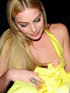 Margot Robbie nipple slip in yellow dress paparazzi photos C