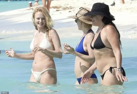 Heather Graham, 51, wows in a cream-colored bikini during 'g