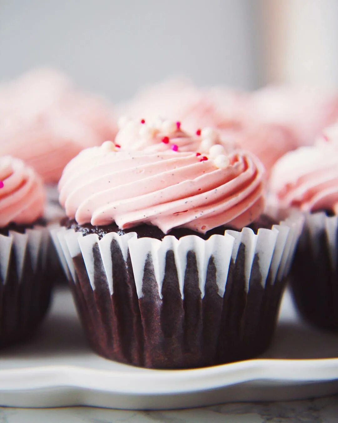 Dreamy, fluffy vanilla bean Italian meringue buttercream on top of mocha cu...