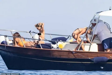 Who WERE the three girls with Eugenie's husband on topless b