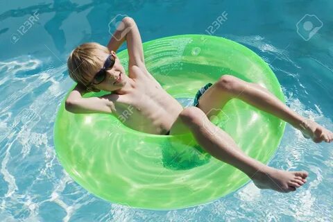 Boy On Float Tube In Swimming Pool Stock Photo, Picture And 