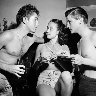 Actors Farley Granger (left) and Roddy McDowall speak with J