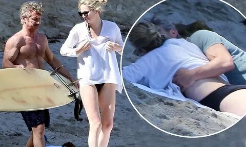 Charlize Theron and shirtless Sean Penn put on an amorous di