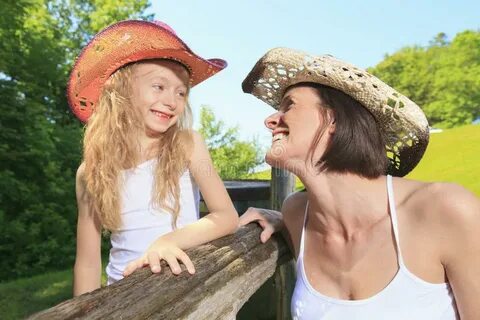 Mother Cowgirl with His Daughter Stock Photo - Image of west